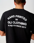 Emblem Back Print T - Black